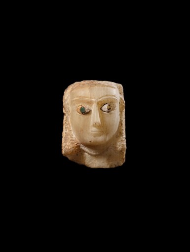 View full screen - View 1 of Lot 19. A South Arabian Alabaster Relief Head of a Woman, circa 3rd Century B.C./1st Century A.D..