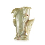 A celadon jade 'lotus' vessel, 17th century | 十七世紀 青玉蓮式花插