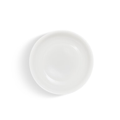 View full screen - View 1 of Lot 5607. A white-glazed incised 'dragon' dish, Ming dynasty, 16th century | 明十六世紀 白釉暗刻雲龍紋盤.