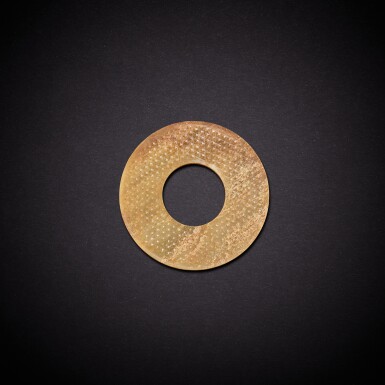 View full screen - View 1 of Lot 7865. A yellowish-celadon jade disc, huan, Western Han dynasty | 西漢 青黃玉蒲紋環.