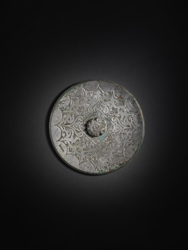View full screen - View 1 of Lot 221. An inscribed bronze 'phoenix' mirror, Eastern Han dynasty | 東漢 銅鳳紋鏡.