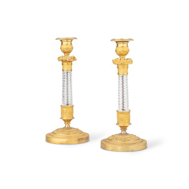 View full screen - View 1 of Lot 140. A pair of Restauration gilt-bronze and cut-glass candlesticks | Paire de bougeoirs en bronze doré et verre taillé, d'époque Restauration.