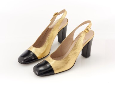 View full screen - View 1 of Lot 80. Pair of gold metallic leather and black patent leather slingback heels.