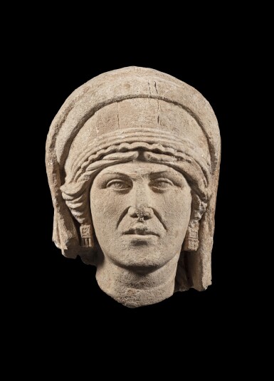 View full screen - View 1 of Lot 27. A Palmyrene Limestone Portrait Head of a Woman, 2nd/3rd Century A.D..
