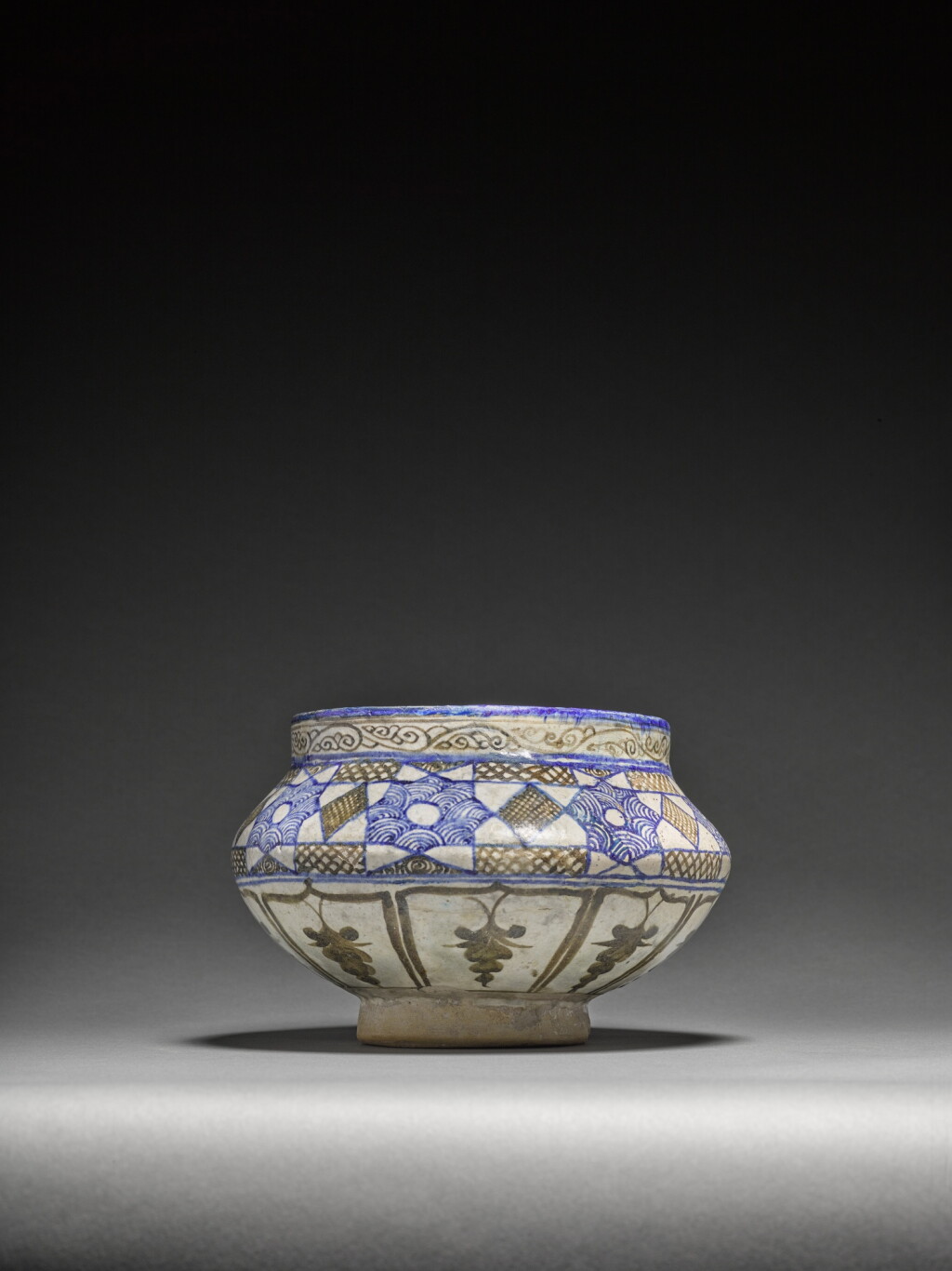 View full screen - View 1 of Lot 130. A Timurid 'double-scroll geometric' pottery bowl, Nishapur, late 15th century.