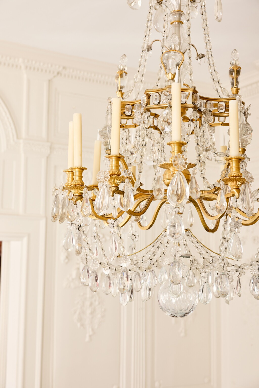 View full screen - View 1 of Lot 678. A gilt-bronze-mounted twelve-light glass chandelier, modern.