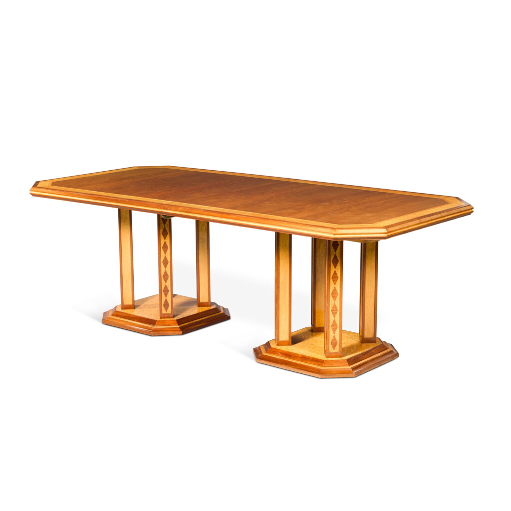 View full screen - View 1 of Lot 607. A bird's eye maple and mahogany extending dining table designed by Robin Moore Ede and executed by Pegram Bianco, 1987.