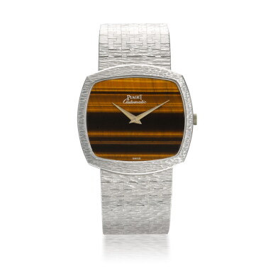 View full screen - View 1 of Lot 1204. PIAGET | REF 12731 A6, WHITE GOLD BRACELET WATCH WITH TIGER'S EYE DIAL CIRCA 1990.