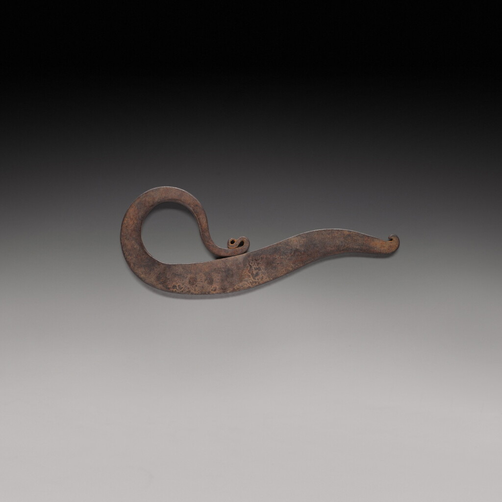 View full screen - View 1 of Lot 206. A bronze flat hook and an engraved steel vice, India, 19th century.