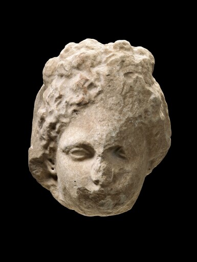 View full screen - View 1 of Lot 169. A Fragmentary Greek Marble Relief Head of a Woman, Attic, late 4th Century B.C..