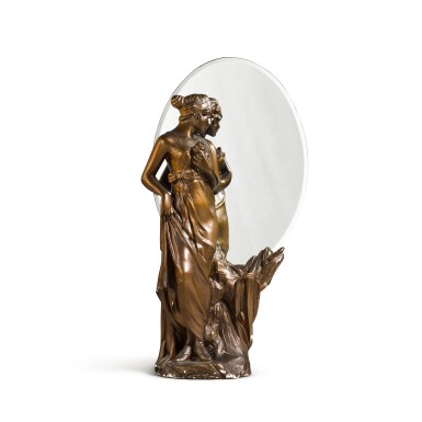 View full screen - View 1 of Lot 1755. An Art Nouveau style oval mirror with bronzed plaster figural support, circa 1974.