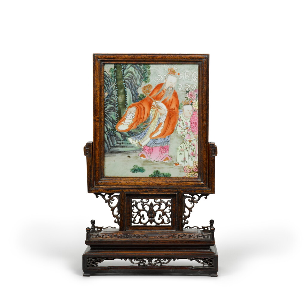 View full screen - View 1 of Lot 2. A brightly enamelled famille-rose plaque mounted as a table screen The porcelain Qing dynasty, circa 1800 | 瓷板為清 約1800年 粉彩神仙圖瓷板小桌屏.