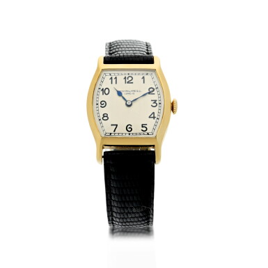View full screen - View 1 of Lot 54. A YELLOW GOLD TONNEAU SHAPED WRISTWATCH, CIRCA 1920.