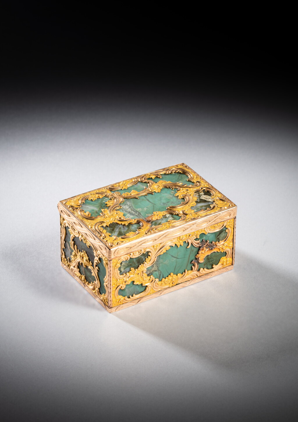 View full screen - View 1 of Lot 250. A gold and hardstone snuff box, London, circa 1765, in the style of boxes retailed by James Cox.