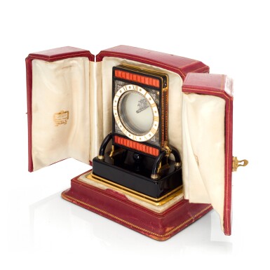 View full screen - View 1 of Lot 93. PENDULE ECRAN AN IMPORTANT AND RARE ROCK CRYSTAL, ONYX, ENAMEL, CORAL, YELLOW GOLD AND DIAMOND-SET MYSTERY DESK TIMEPIECE, CIRCA 1926.
