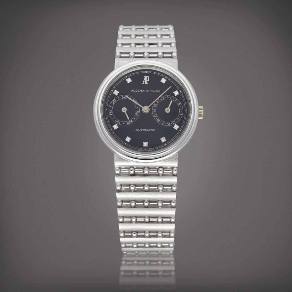 View full screen - View 1 of Lot 584. Classique Day-Date, Reference 25574 | A white gold wristwatch with diamond-set indexes, day, date and bracelet | Circa 1980.