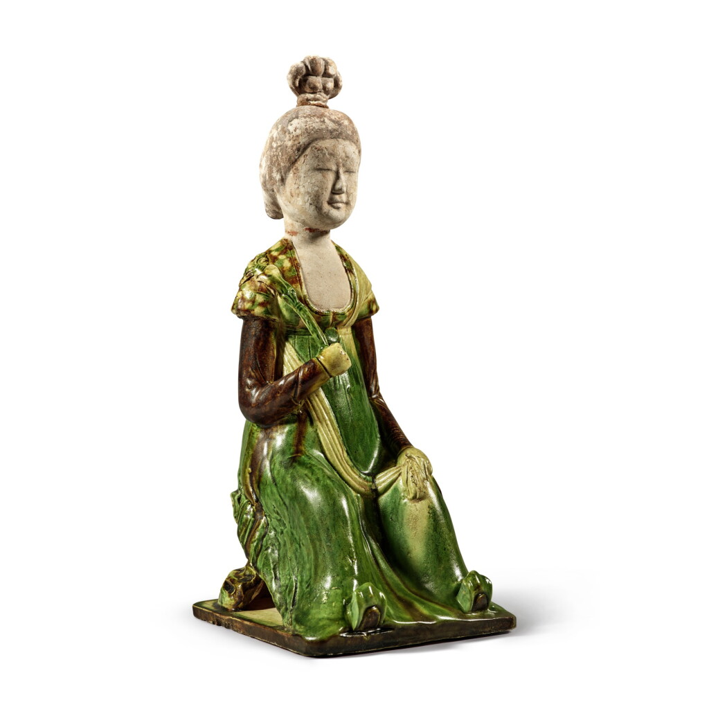 View full screen - View 1 of Lot 179. A sancai-glazed pottery figure of a seated court lady, Tang dynasty | 唐 三彩仕女坐俑.