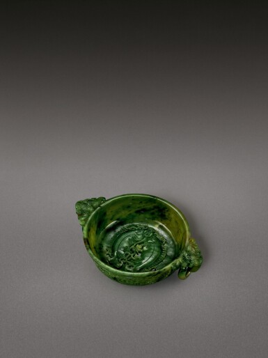 View full screen - View 1 of Lot 2132. A spinach-green jade 'twin fish' marriage bowl Qing dynasty, Qianlong period | 清乾隆 碧玉年年有餘雙蝠活環耳洗.