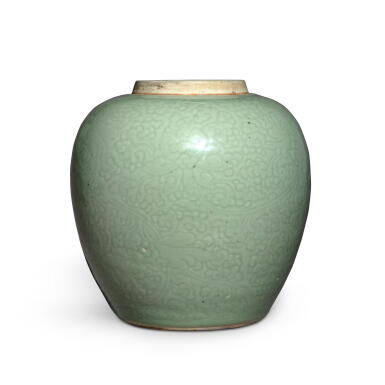 View full screen - View 1 of Lot 921. A carved celadon-glazed 'lotus' jar, Qing dynasty, Kangxi period | 清康熙 青釉刻纏枝蓮紋罐.
