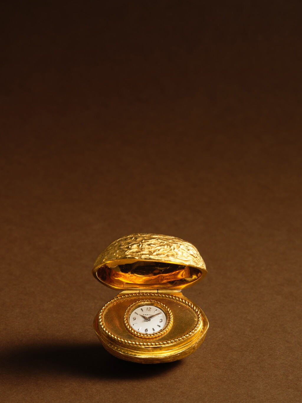 View full screen - View 1 of Lot 2240. An unusual yellow gold purse watch in the form of a walnut, Circa 1958-59.