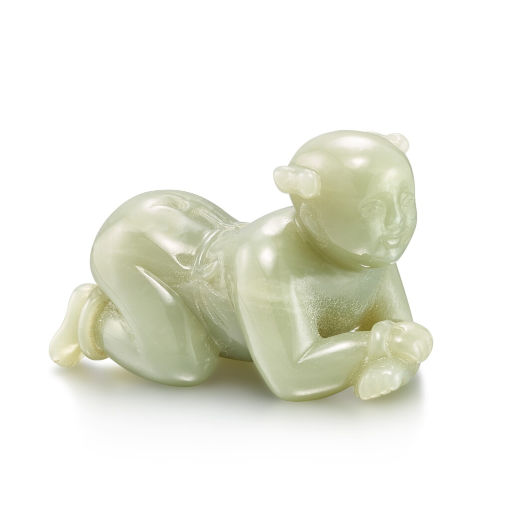 View full screen - View 1 of Lot 498. A celadon jade figure of a boy, Qing dynasty 清 青白玉跪臥童子.