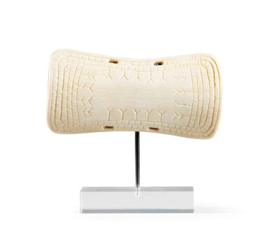 View full screen - View 1 of Lot 57. Protège-poignet en ivoire de morse, Inuit, Alaska | An Inuit walrus ivory wrist guard, Alaska.