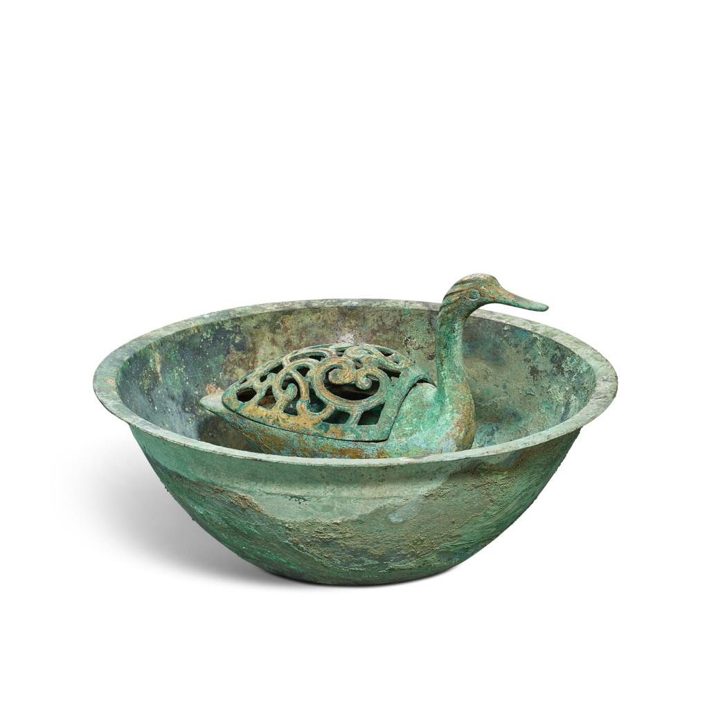 View full screen - View 1 of Lot 3599. A gilt-bronze 'goose' incense burner and basin, Han dynasty | 漢 銅鎏金鵝型熏爐及盆.