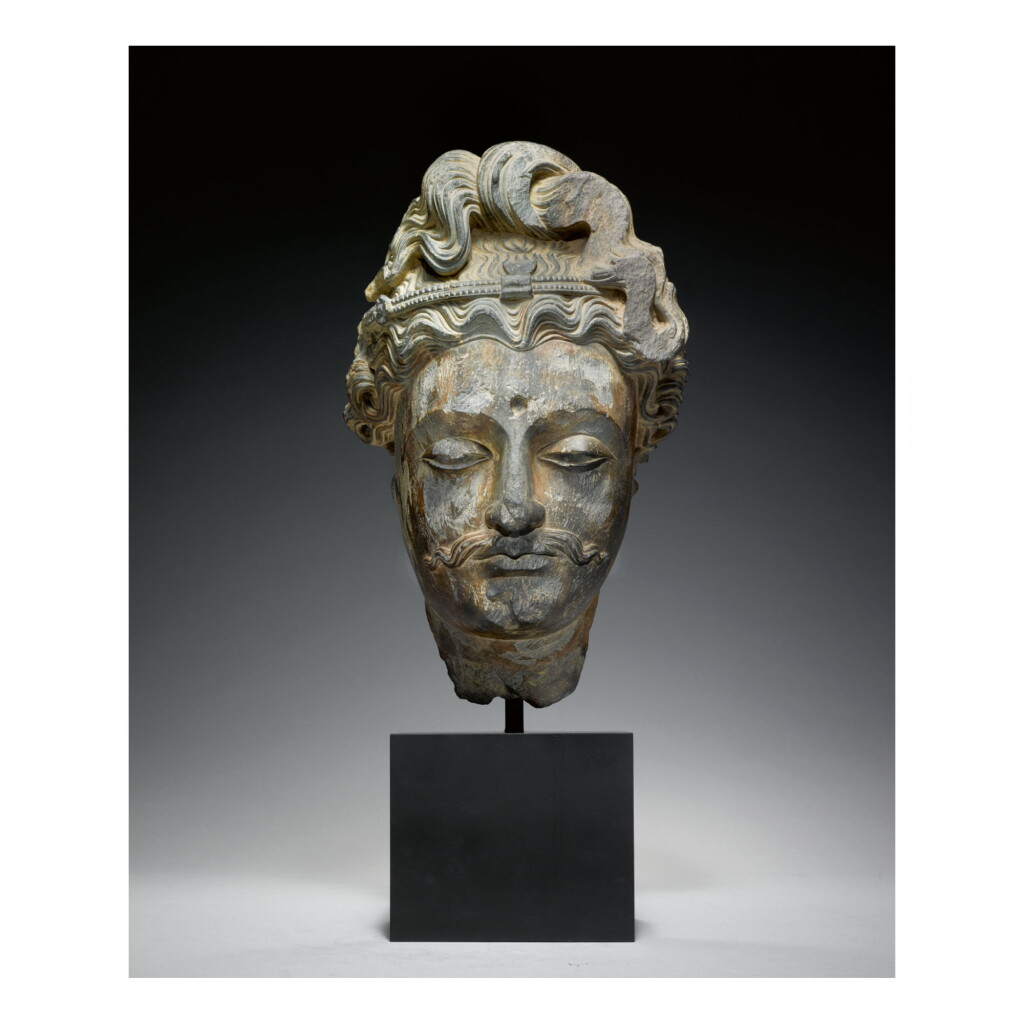View full screen - View 1 of Lot 349. A GREY SCHIST SANDSTONE HEAD OF A BODHISATTVA, ANCIENT REGION OF GANDHARA, 2ND/3RD CENTURY .