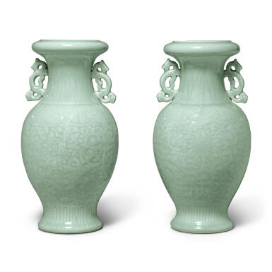 View full screen - View 1 of Lot 1052. A pair of carved celadon-glazed 'lotus' vases, 20th century | 二十世紀 粉青釉刻纏枝蓮紋雙耳瓶一對 《大清乾隆年製》仿款.