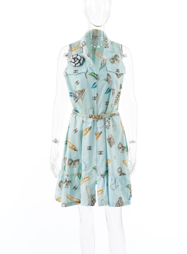 View full screen - View 1 of Lot 122. CHANEL | BLUE COTTON PRINTED DRESS WITH CAMELLIA BROOCH AND MATCHING CLASSIC SHOULDER BAG.