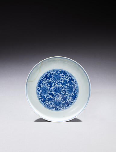 View full screen - View 1 of Lot 164. A blue and white ‘lotus’ dish, Mark and period of Yongzheng | 清雍正 青花纏枝番蓮紋盤 《大清雍正年製》款.