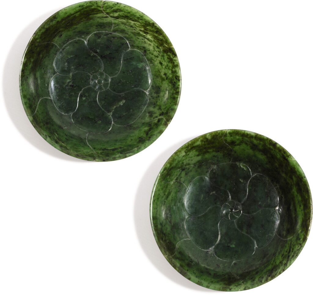 View full screen - View 1 of Lot 354. A PAIR OF SPINACH-GREEN JADE 'MALLOW' DISHES QING DYNASTY, 18TH/19TH CENTURY | 清十八/十九世紀 碧玉葵花形盤一對.