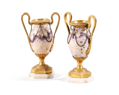 View full screen - View 1 of Lot 96. A pair of gilt-bronze mounted Blue John vases, late 18th century | Paire de petits vases en spath fluor à monture en bronze doré de la fin du XVIIIème siècle.