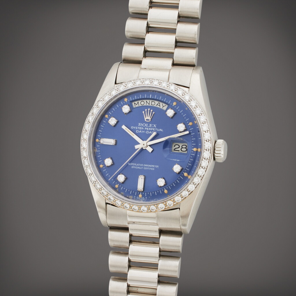 View full screen - View 1 of Lot 15. Reference 1804 Day-Date | A platinum and diamond-set wristwatch with day, date, and bracelet, Circa 1978.