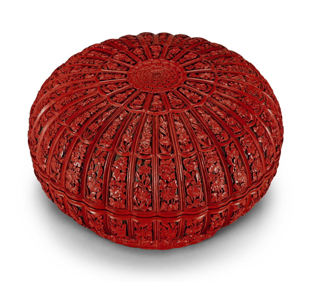 View full screen - View 1 of Lot 110. A WELL CARVED CINNABAR LACQUER 'CHRYSANTHEMUM' BOX AND COVER QING DYNASTY, QIANLONG PERIOD | 清乾隆 剔紅花卉紋菊瓣式蓋盒.