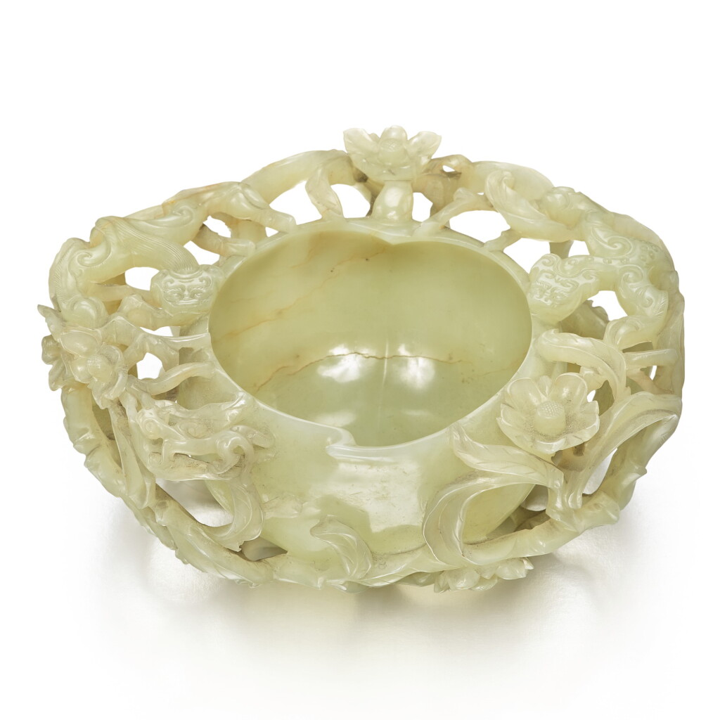 View full screen - View 1 of Lot 35. A celadon jade peach-form waterpot, Ming dynasty | 明 青玉鏤雕穿花螭龍紋桃形洗.