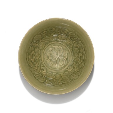 View full screen - View 1 of Lot 112. A Yaozhou carved and moulded 'peony and small bird' bowl, Northern Song dynasty | 北宋 耀州窰青釉刻纏枝牡丹紋盌 .