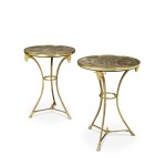 A Pair of Directoire Style Gilt Bronze Gueridons with grey-brown marble tops
