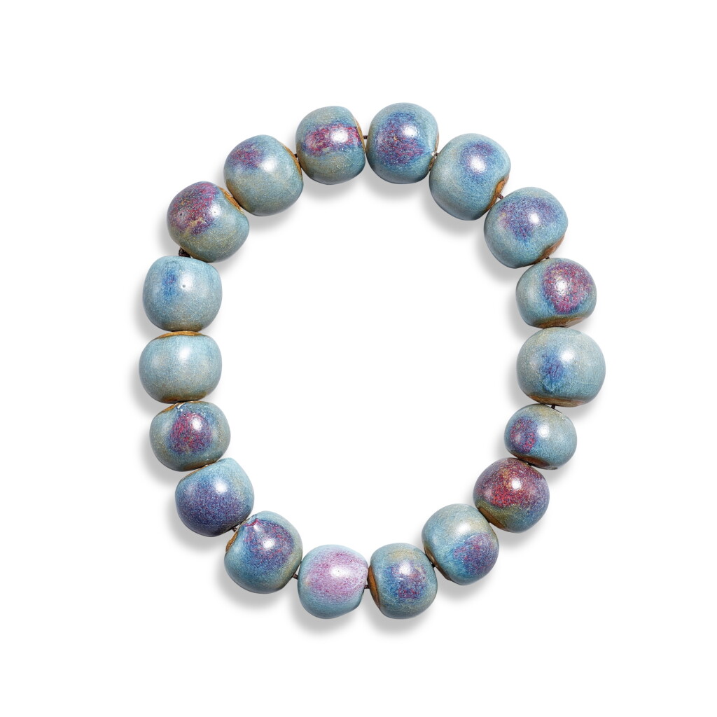 View full screen - View 1 of Lot 3672. A Junyao purple-splashed rosary bracelet, Yuan - Ming dynasty | 元至明 鈞窰藍釉紫斑十八子手串.