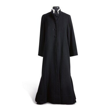 View full screen - View 1 of Lot 64. GEORGIA O'KEEFFE | BLACK FLOOR-LENGTH OVERCOAT BY K. C. CHANG, MADE IN HONG KONG.