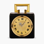 An onyx, silver-gilt, gold, enamel and diamond-set 8-day desk clock, Circa 1919