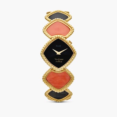 View full screen - View 1 of Lot 575. Reference 9231 N4 | Retailed by Van Cleef & Arpels: A yellow gold, onyx, and coral bracelet with with onyx dial, Circa 1970.