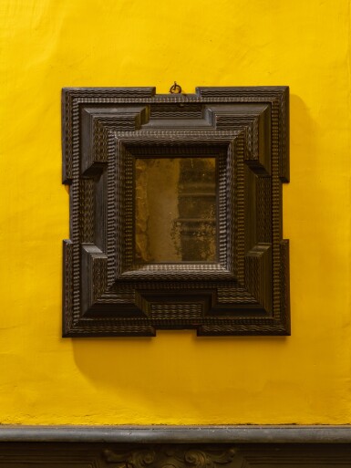 View full screen - View 1 of Lot 140. A Dutch ripple-moulded ebonised mirror, 17th century | Miroir en bois noirci, Hollande, XVIIe siècle.