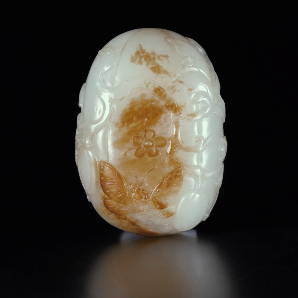 View full screen - View 1 of Lot 112. A white and russet jade 'butterfly and melon' snuff bottle, Qing dynasty, 18th century .
