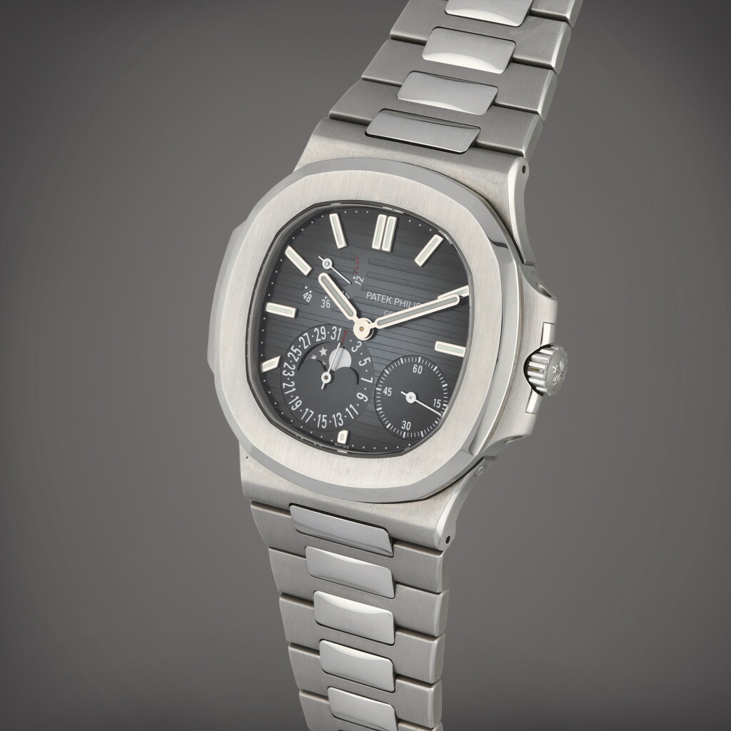 View full screen - View 1 of Lot 42. Nautilus, Reference 5712/1A-001 | A stainless steel wristwatch with date, moon phases, power reserve indication and bracelet | Circa 2019.
