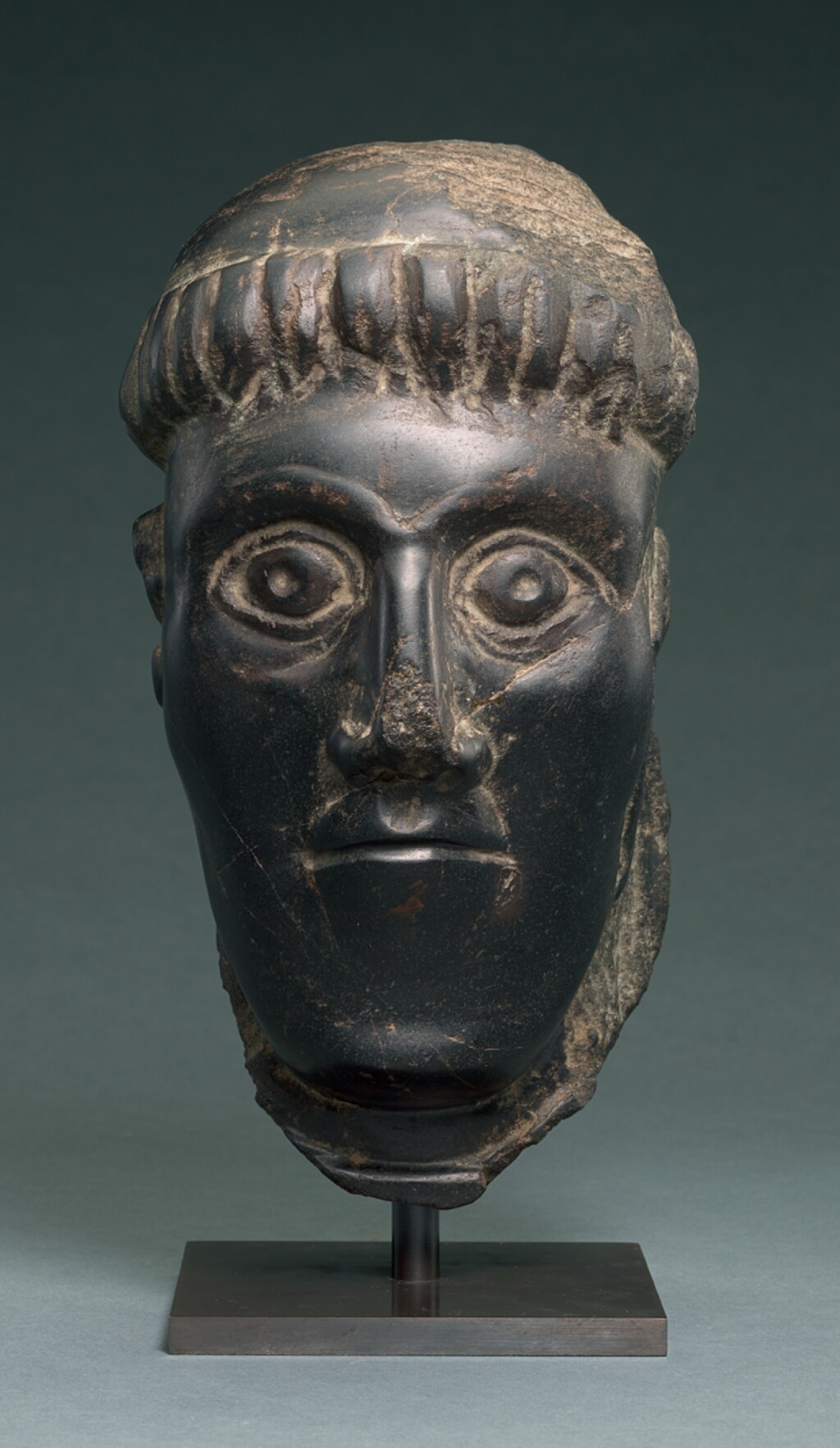 View full screen - View 1 of Lot 6. IRISH, CIRCA 11TH CENTURY | HEAD OF A BISHOP SAINT.