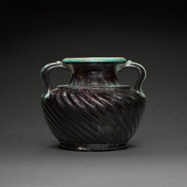 View full screen - View 1 of Lot 14. An Egyptian Deep Aubergine and Turquoise Faience Vase, Roman Period, circa 1st Century A.D..