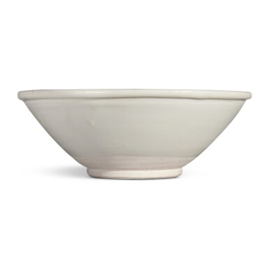 View full screen - View 1 of Lot 663. A rare and large 'Xing' conical bowl, Tang dynasty / Five Dynasties | 唐 / 五代 邢窰白釉大盌.