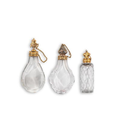 View full screen - View 1 of Lot 602. A group of three rock-crystal and glass scent bottles with varicolour gold mounts, Paris, third quarter of the 18th century.