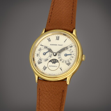 View full screen - View 1 of Lot 50. A yellow gold wristwatch with day, date and moon phases | Circa 1990.